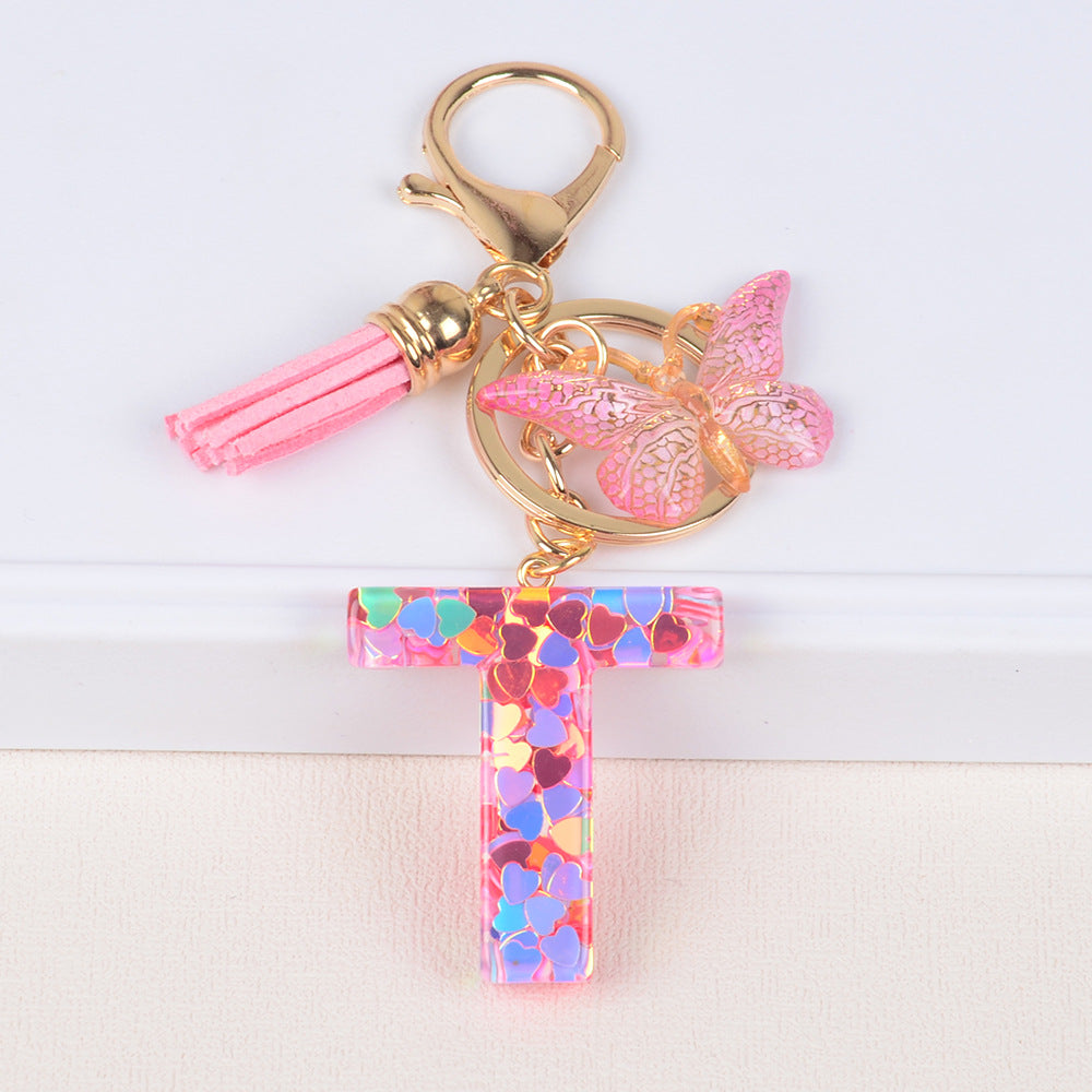 卸売ピンクタッセルバタフライグリッターレター樹脂キーホルダー